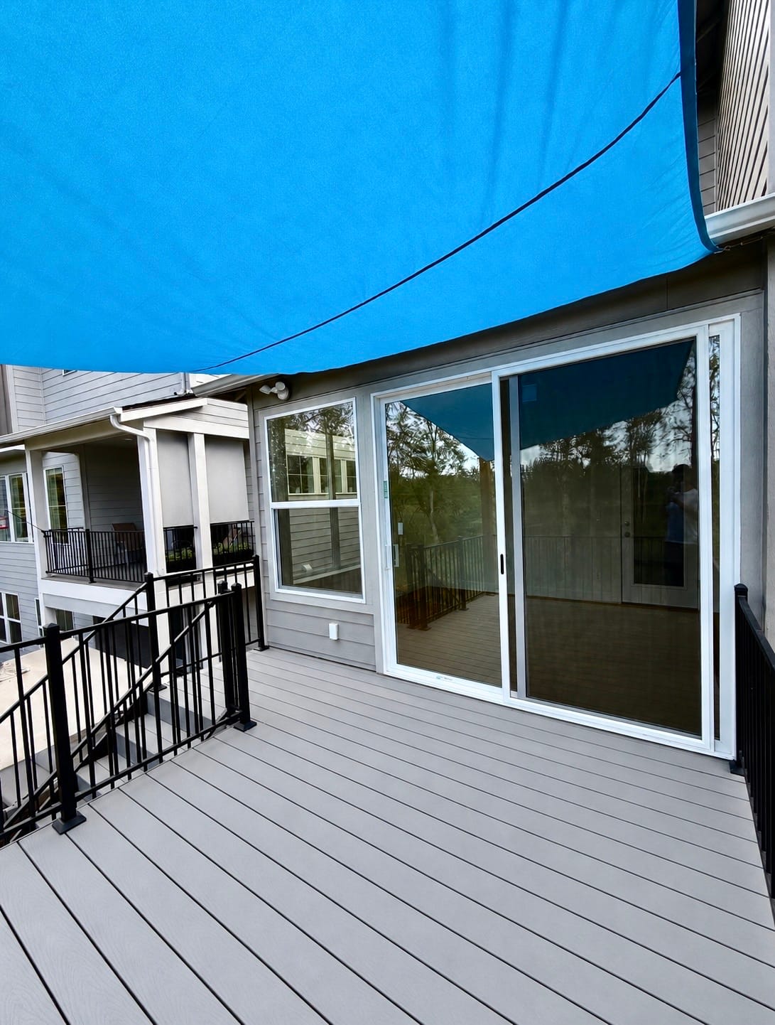 Finished composite deck off sliding glass doors of new home addition, Bethany Oregon