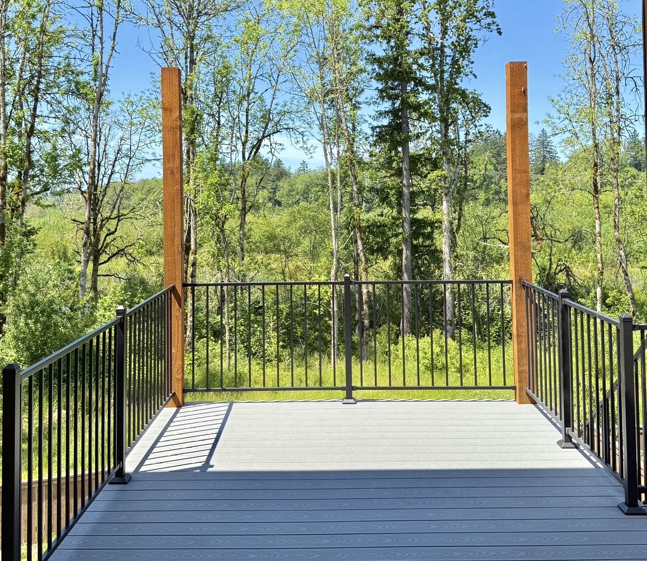 Composite deck with treeline view, Bethany Elevated composite deck overlooking the treeline, Bethany Oregon remodel by Masters Construction Group